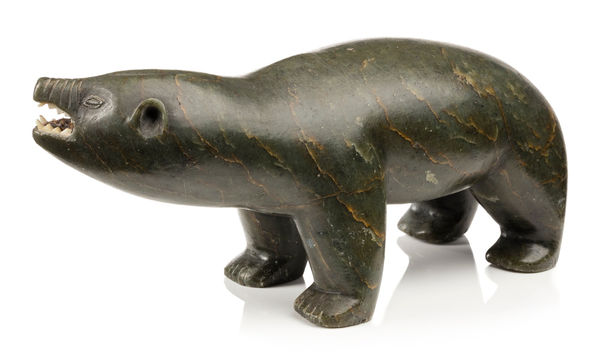 Lot 116 POSSIBLY ELIJASSIAPIK (1912-1972) INUKJUAK (PORT HARRISON) Snarling Polar Bear, c. late 1950s stone and ivory, 4 x 9 x 3.25 in (10.2 x 22.9 x 8.3 cm) ESTIMATE: $2,500 — $3,500 PRICE REALIZED: $2,640.00
