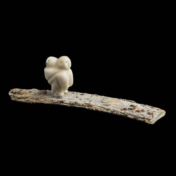 Mother with a Child in her Amaut, Walking