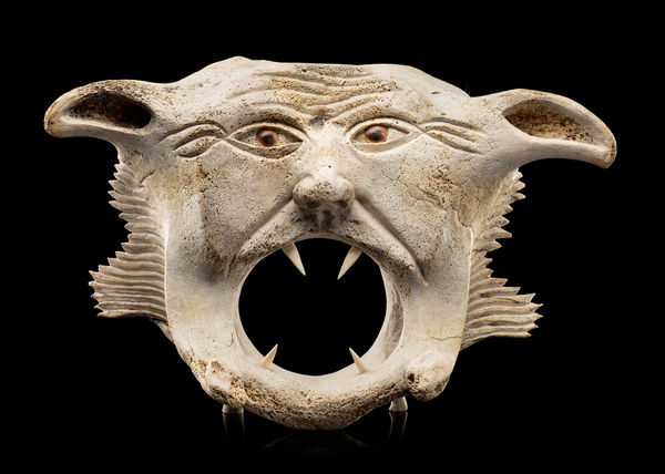 Lot 17 MANASIE AKPALIAPIK (1955-) IKPIARJUK (ARCTIC BAY) / ONTARIO Power of the Shaman (Angagok), 1989 whale bone, antler, ivory, and shells, 11 x 17.5 x 5.25 in (27.9 x 44.5 x 13.3 cm) ESTIMATE: $6,000 — $9,000 PRICE REALIZED: $7,320.00