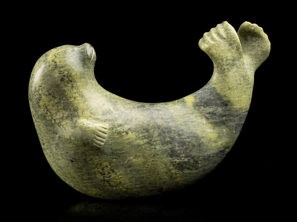 Lot 42 PAUTA SAILA, R.C.A. (1916-2009) KINNGAIT (CAPE DORSET) Playful Seal, c. 1970 stone, 4.5 x 3.25 x 6.5 in (11.4 x 8.3 x 16.5 cm) ESTIMATE: $1,000 — $1,500 PRICE REALIZED: $2,196.00