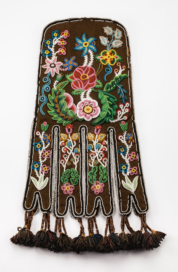 Lot 141 UNIDENTIFIED ARTIST, PROBABLY MÉTIS OR POSSIBLY TLINGIT Octopus Bag, c. 1860s trade cloth, glass beads, steel cut beads, wool yarn, hide, cotton cloth and thread, 20.5 x 10 x 0.25 (52.1 x 25.4 x 0.6 cm) ESTIMATE: $12,000 — $18,000 PRICE REALIZED: $12,000.00