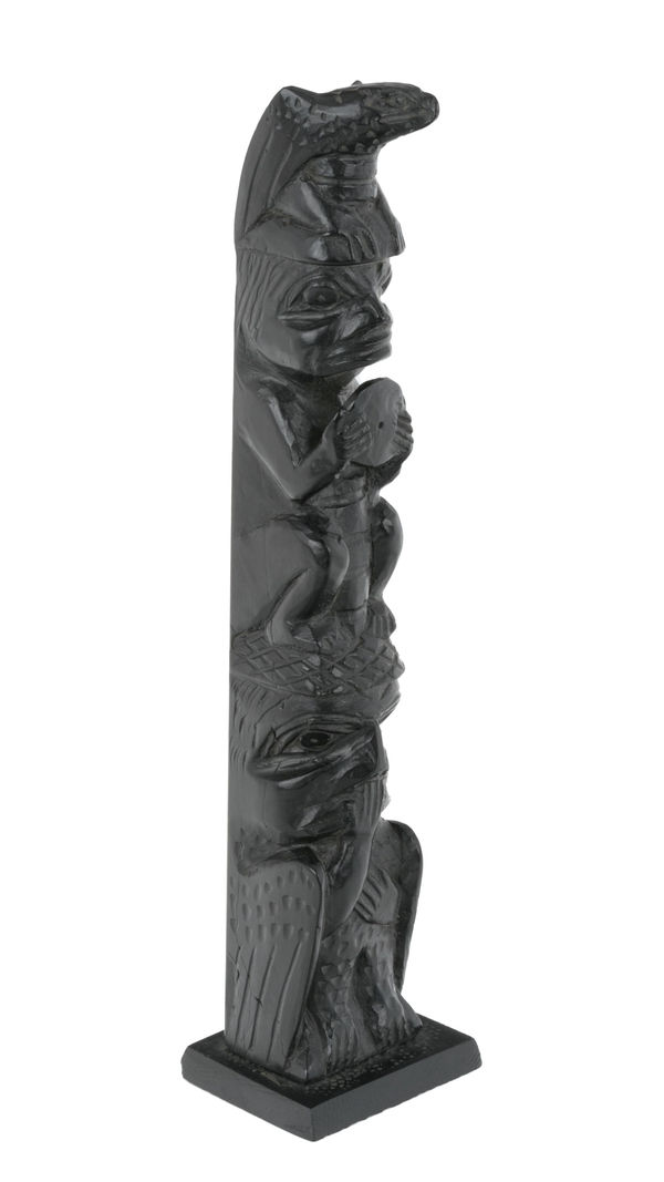 Lot 31 CAPTAIN ANDREW BROWN (1879-1962), HAIDA, MASSET, HAIDA GWAII Model Totem Pole, c. 1950s argillite, 7.5 x 1.75 x 1 in (19.1 x 4.4 x 2.5 cm) ESTIMATE: $500 — $800 PRICE REALIZED: $793.00