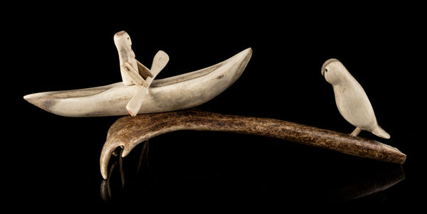 Lot 173 ELIZABETH NUTARAALUK AULATJUT (1914-1998) ARVIAT (ESKIMO POINT) Kayaker and Owl, c. late 1960s antler and black inlay, 5.25 x 16 x 5 in (13.3 x 40.6 x 12.7 cm) ESTIMATE: $1,200 — $1,800 PRICE REALIZED: $1,080.00