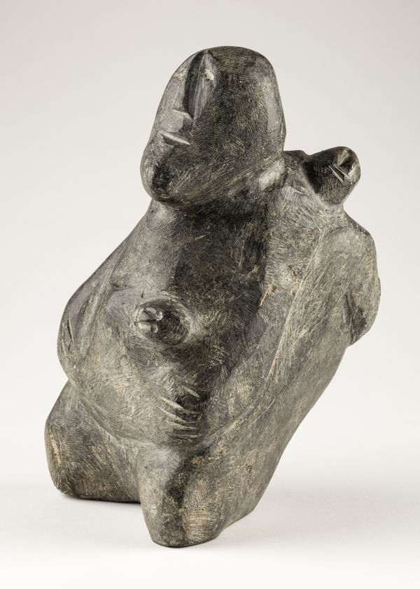 ELIZABETH NUTARAALUK AULATJUT (1914-1998) ARVIAT (ESKIMO POINT) Mother and Child with Fish, c. 1982 stone, 8.5 x 5.5 x 6 in (21.6 x 14 x 15.2 cm)