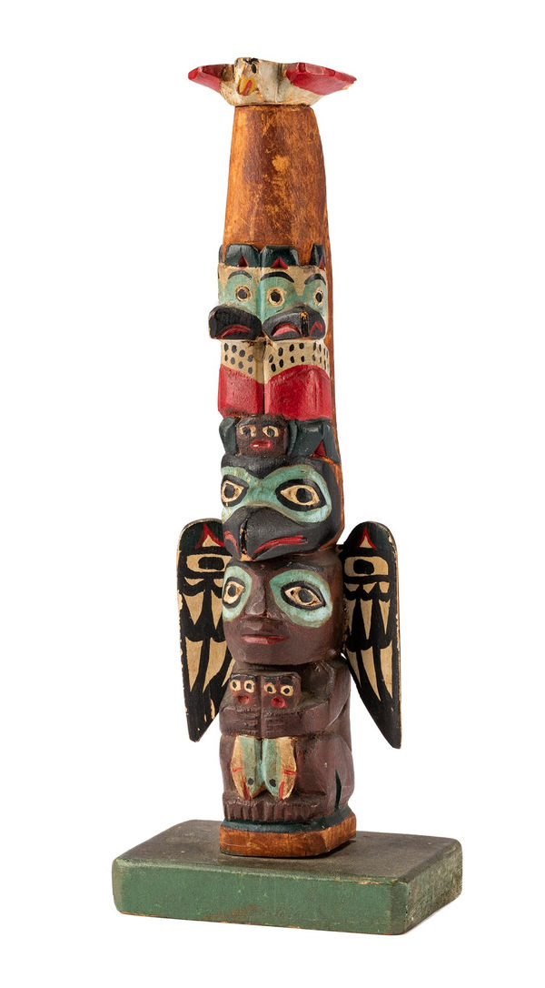 Lot 99 ELI TAIT (1872-1949) TSIMSHIAN, METLAKATLA, ALASKA Model Totem Pole, c. 1920s or 1930s carved and painted wood, 7.5 x 2.75 x 2 in (19.1 x 7 x 5.1 cm) ESTIMATE: $1,200 — $1,800 PRICE REALIzeD: $1,440.00