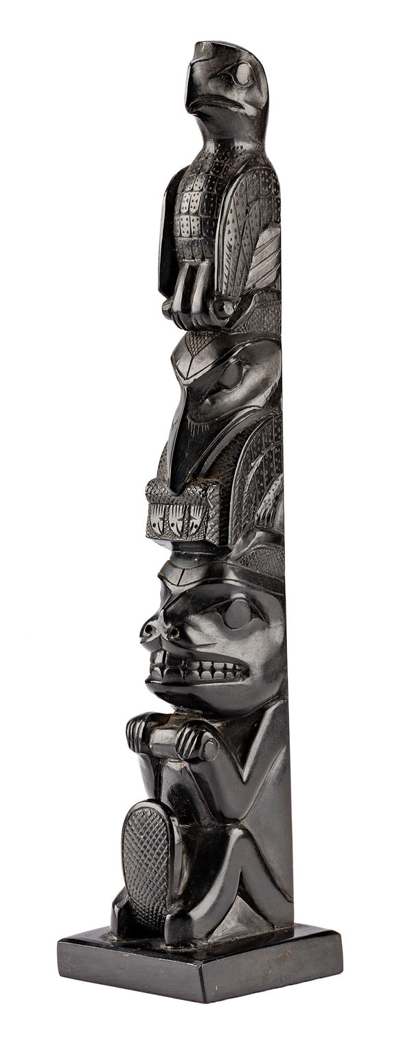 Lot 54 POSSIBLY PAUL JONES (c. 1847-1927), SKIDEGATE, HAIDA GWAII Model Totem Pole, c. 1890-1910 argillite, 9.5 x 2 x 2 in (24.1 x 5.1 x 5.1 cm) ESTIMATE: $⁠2,500 — $3,500 PRICE REALIZED: $2,400.00
