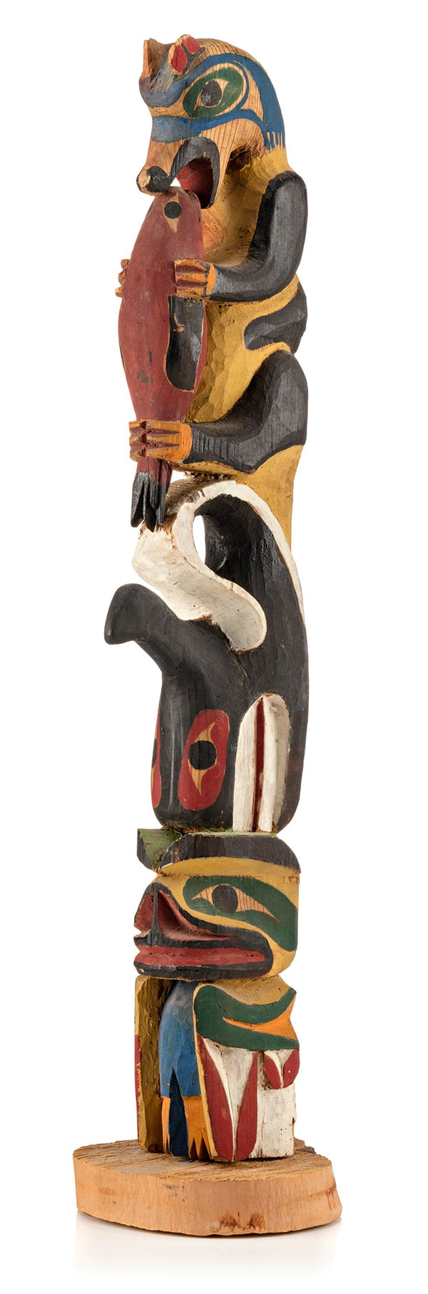 Lot 128 UNIDENTIFIED DITIDAHT OR NUU-CHAH-NULTH ARTIST Four-Figure Model Totem Pole, c. 1920-1930 cedar and pigments, 13.75 x 3 x 3.25 in (34.9 x 7.6 x 8.3 cm) ESTIMATE: $2,000 — $3,000 PRICE REALIZED: $1,800.00
