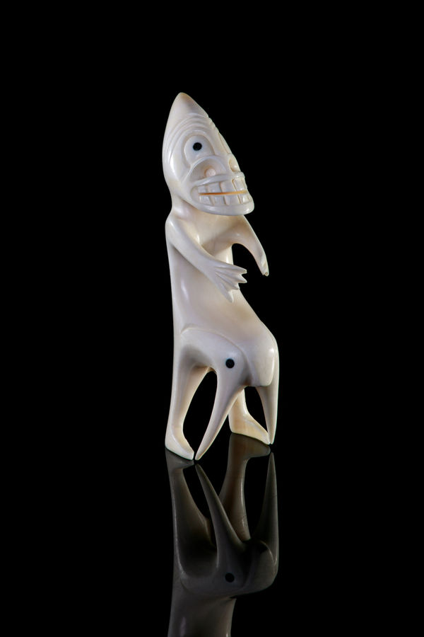 Lot 34 UNIDENTIFIED ARTIST, GREENLAND Tupilak ivory and black inlay, 4.75 x 1.5 x 1.75 in (12.1 x 3.8 x 4.4 cm) PRICE REALIZED: $393.60