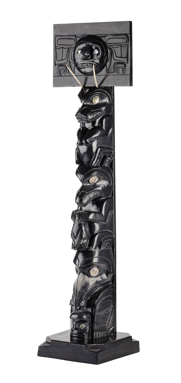 Lot 115 RUFUS MOODY, C.M. (1923-1998) SKIDEGATE, B.C. Model Mortuary Pole, late 1960s or early 1970s argillite, antler, and abalone, 36.125 x 8.5 x 8.5 in (91.6 x 21.5 x 21.5 cm) ESTIMATE: $20,000 — $30,000 PRICE REALIZED: $26,400.00