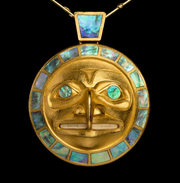 Lot 60 ROBERT DAVIDSON (GUUD SANS GLANS), C.M., O.B.C., (1946-) HAIDA, MASSET / WHITE ROCK Hawk Moon Pendant, 2000 the pendant: 22 kt cast gold abalone shell, and mastodon ivory, 2.5 x 2 x 1 in (6.3 x 5.1 x 2.5 cm) / the chain: 22 kt gold; total weight: 68 g ESTIMATE: $70,000 ⁠&mdash; $100,000 Price realized: $50,000
