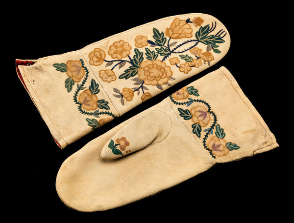Lot 143 UNIDENTIFIED ARTIST, CREE-MÉTIS Pair of Embroidered Mittens, c. 1860s tanned hide, trade cloth, and silk thread, 12.25 x 6.25 x 1.25 in (31.1 x 15.9 x 3.2 cm) ESTIMATE: $3,000 — $5,000 PRICE REALIZED: $2,688.00