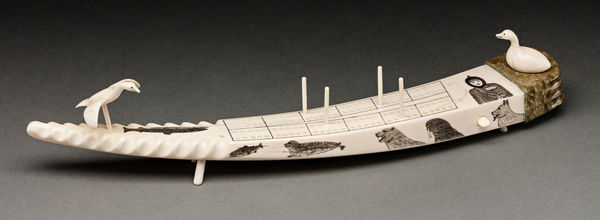 Lot 150 DAVIDEE ITULU (1929-2006) KIMMIRUT (LAKE HARBOUR) Cribbage Board, 1965 ivory, stone, and black ink, 13.5 x 2.5 x 3.25 in (34.3 x 6.3 x 8.3 cm) ESTIMATE: $1,800 — $2,800 PRICE REALIZED: $3,120.00