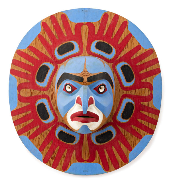 Lot 141 BEAU DICK (1955-2017) KWAKWA̱KA̱ʼWAKW Bella Coola Sun Mask, 1986 yellow cedar, acrylic paint, and hide fasteners, 22.25 x 24.24 x 7.5 in (56.5 x 61.6 x 19.1 cm) ESTIMATE: $8,000 — $12,000 PRICE REALIZED: $18,000.00