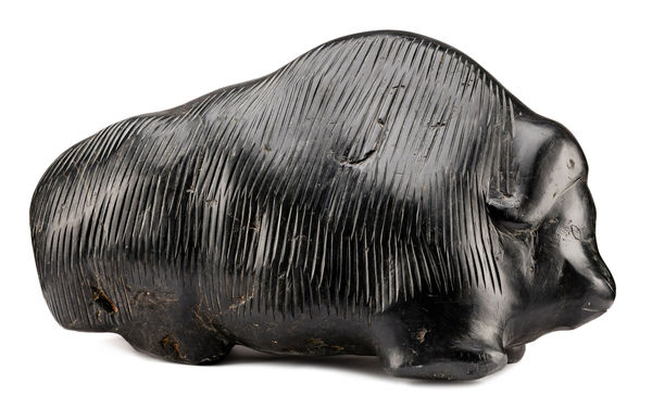 Lot 114 BARNABUS ARNASUNGAAQ (1924-2017) Qamani’tuaq (BAKER LAKE) Muskox, c. 1980 stone, 13 x 23 x 9.5 in (33 x 58.4 x 24.1 cm) ESTIMATE: $25,000 — $35,000 PRICE REALIZED: $45,600.00