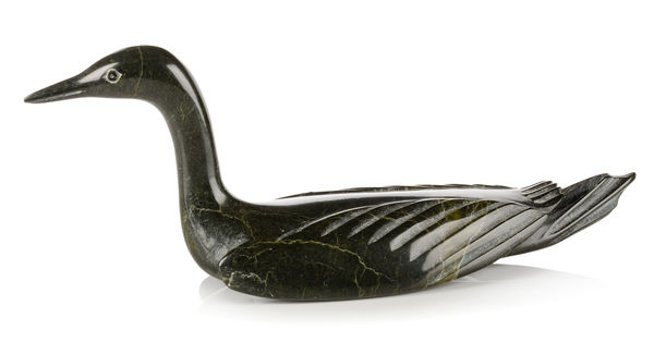 Lot 49 SHEOKJUK OQUTAQ (1920-1982) KINNGAIT (CAPE DORSET) Swimming Loon, early 1970s stone, 4.25 x 10.25 x 3 in (10.8 x 26 x 7.6 cm) ESTIMATE: $1,200 — $1,800 PRICE REALIZED: $1,952.00