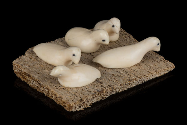 Lot 15 UNIDENTIFIED INUIT ARTIST, ARVILIQJUAQ (PELLY BAY) Rookery, 1970s ivory, whale bone, and black inlay, 1.5 x 3 x 2.5 in (3.8 x 7.6 x 6.3 cm) ESTIMATE: $100 — $200 PRICE REALIZED: $97.60