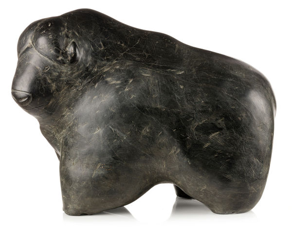Lot 22 PETER SEVOGA (1940-2007), QAMANI’TUAQ (BAKER LAKE) Muskox, c. 1972 stone, 14 x 19.5 x 10.5 in (35.6 x 49.5 x 26.7 cm) ESTIMATE: $20,000 — $30,000 PRICE REALIZED: $16,800.00