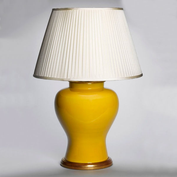 An Imperial yellow temple jar now mounted as a lamp with hand gilded turned base