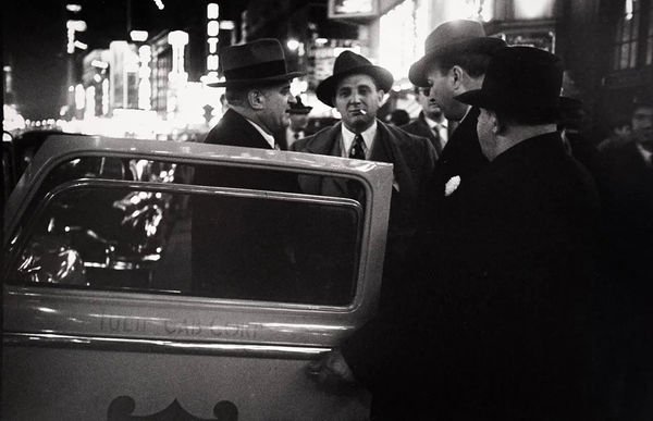 Louis Faurer, Untitled, New York City (four men with cab door), 1950.