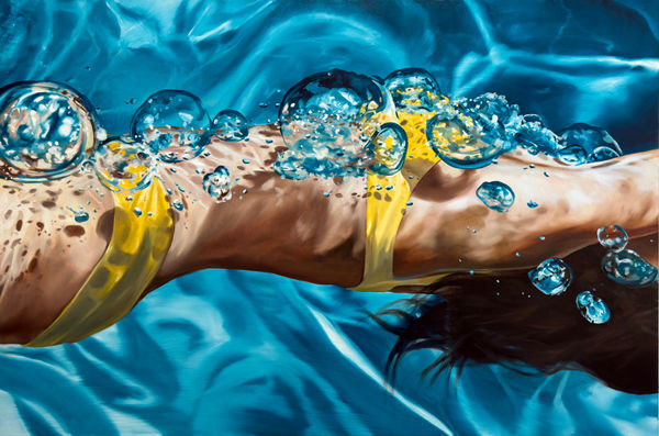 Torso of female swimmer in yellow bathing suit