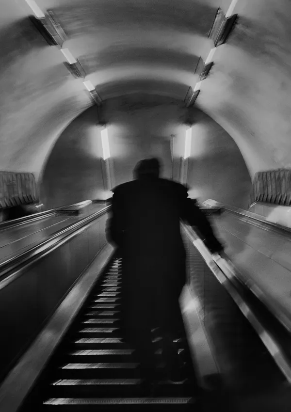 Langer photograph man on escalator