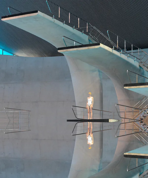 Maria Svarbova photograph swimmer in white swimsuit yellow cap high dive grey background Gilman Contemporary