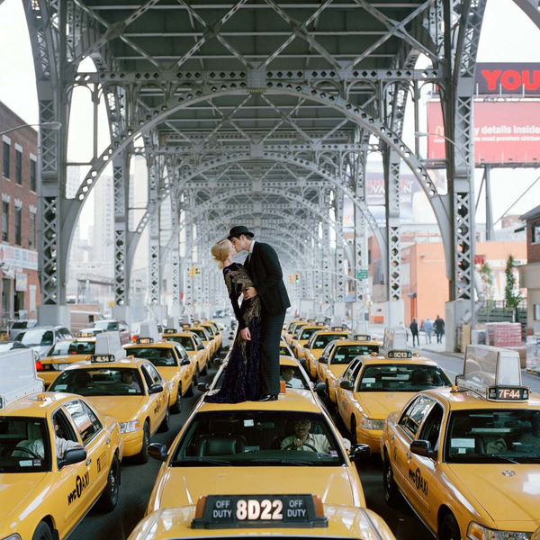 Rodney Smith Getty image man and woman kissing on top of a New York City Taxi buy here Sun Valley art Gallery