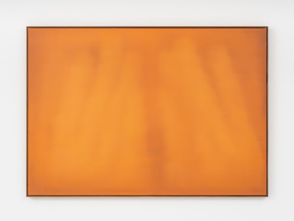 The work contains various hues of deep orange, with the darkest pointing being a soft linear shape running through the center of the canvas.