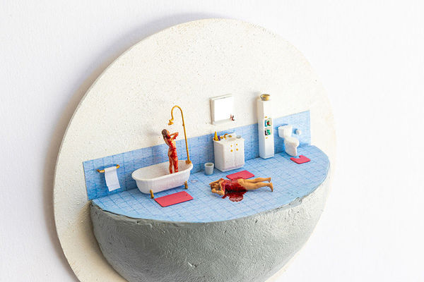 miniature diorama by Abigail Goldman a bloody woman washing herself in the shower next to a body bleeding out on the floor