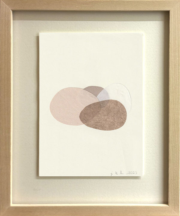 Abstract paper and tape collage with light brown, pink, and yellow circular shapes