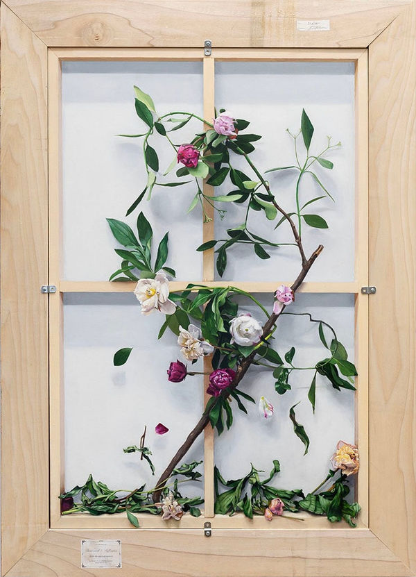 painting of flowers with little dog face on the back of stretched and framed canvas