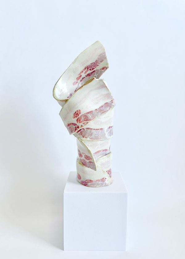Ceramic vase made in the shape of raw wrapped bacon