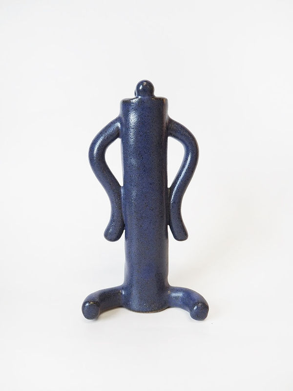 ceramic piece by Jocelyn Tsaih of a tall deep purple figure sitting