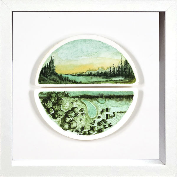 Framed painting on two halves of a circle with a lake landscape