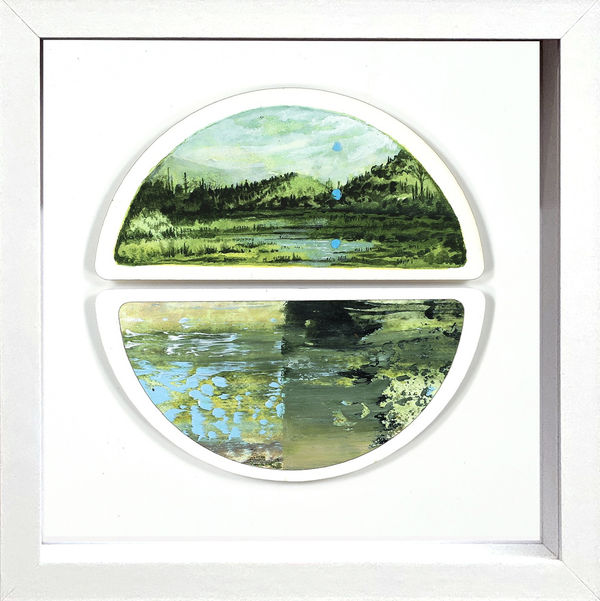Framed painting on two halves of a circle of a green mountain landscape