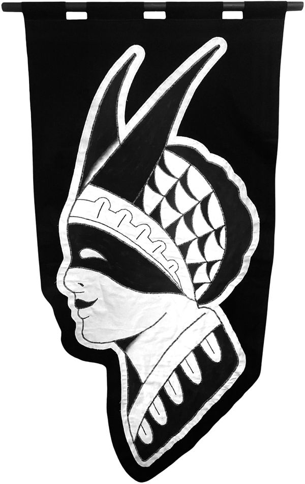 embroidered black and white banner of a person side profile wearing a mask