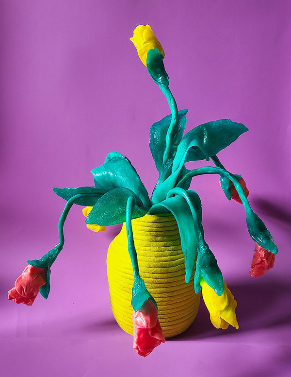 Allison Baker's sculpture of flowers in a yellow vase