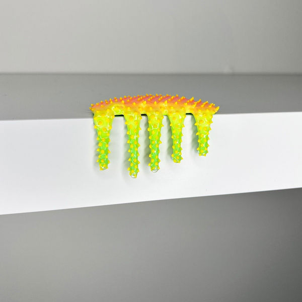 blob sculpture in yellow and green