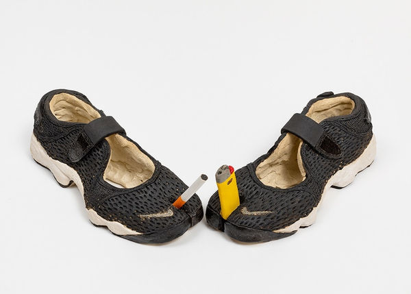 Didi Rojas sculpture of pair of Tabis one w cigarette and the second with lighter