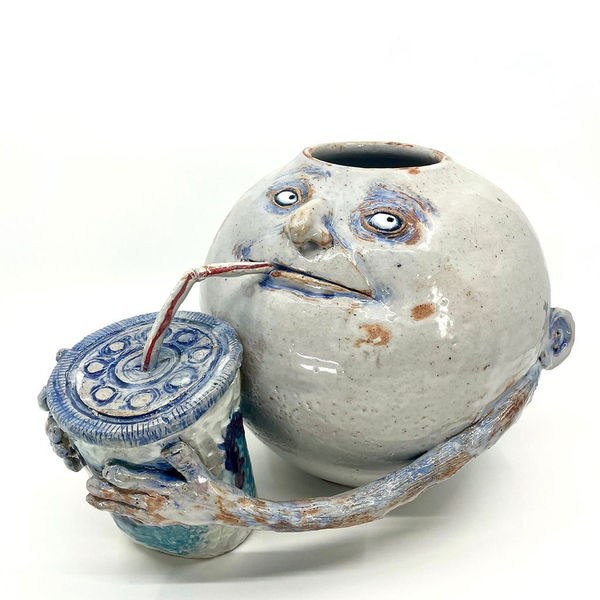 Dave Zackin's vase of figure drinking out of a cup