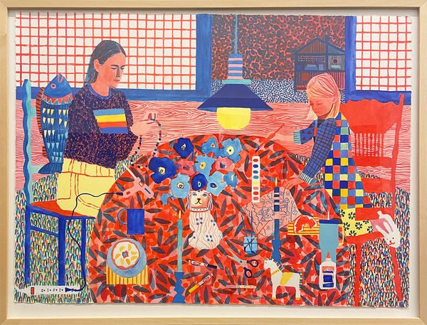 Framed red, blue, and yellow painting of two girls sitting at a table making crafts.
