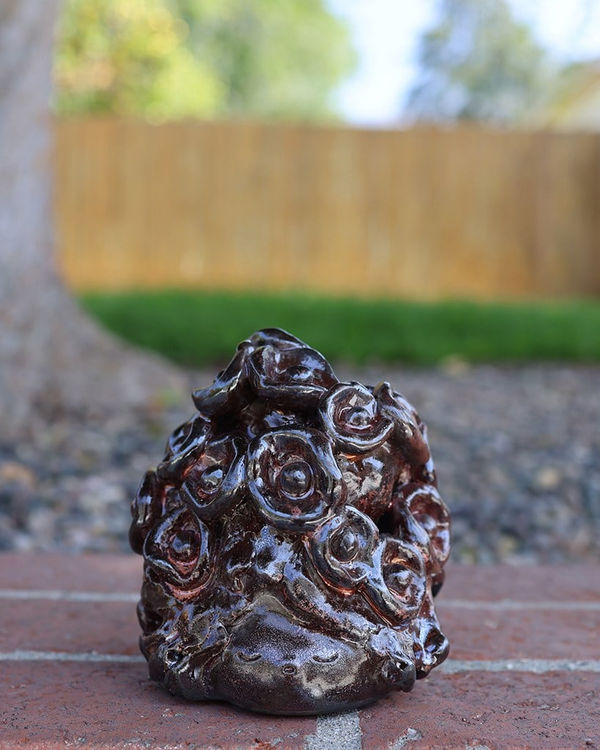 So Youn Lee dark ceramic scup'ture of mound of flowers