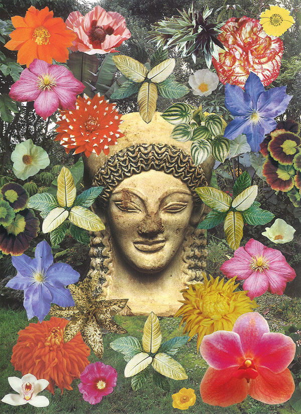 yellow statue head/bust surrounded by colorful flowers