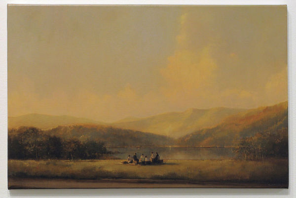 Group of people side on blocks on a grassy landscape overlooking lack with trees, mountains and sky. Scene is depicted in yellow sepia tones.