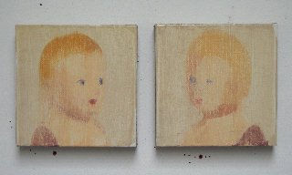 Two portraits of blonde baby dolls face each other from two separate panels.