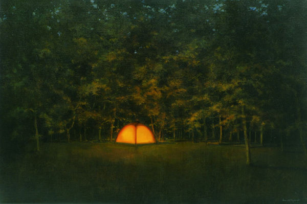 Camping tent illuminated with warm orange light is surrounded by a grassy field and a forest of trees.