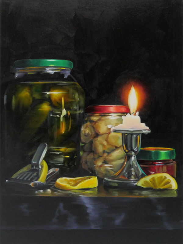 Still life of lit candle, three jars of different preserved vegetables, and three yellow lemon slices, one being juiced.