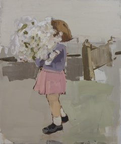 Small girl is walking and holding a giant white bouquet that obscures her face. Behind her is a gray fence, grass and sky.