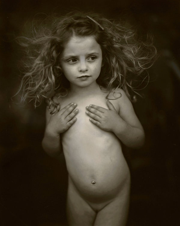 Sally Mann Immediate Family series, Modest Child, photograph of Virginia holding her hands over her chest