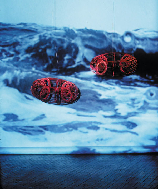 Scherezade García Endless Love I from the series Endless Love, Stories of Salvation, 1999 Installation: 2 Wooden innertubes and video Each innnertube: 26 in (66 cm) diameter Installation: Dimensions variable